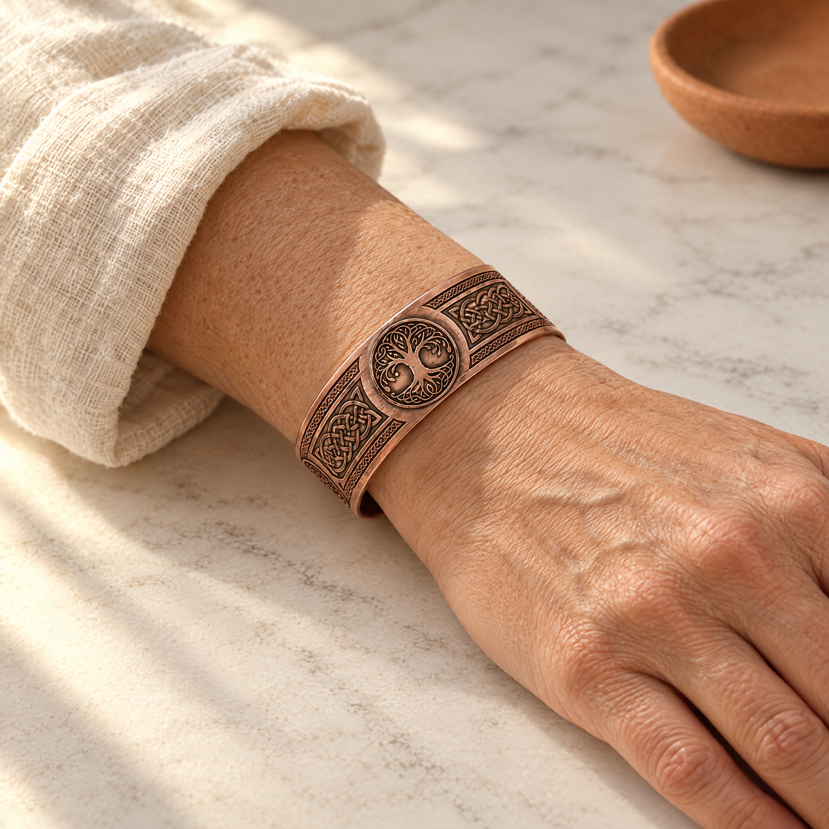 June's Bough Copper Bracelet – pure copper bracelet on a warm neutral background - photo 2