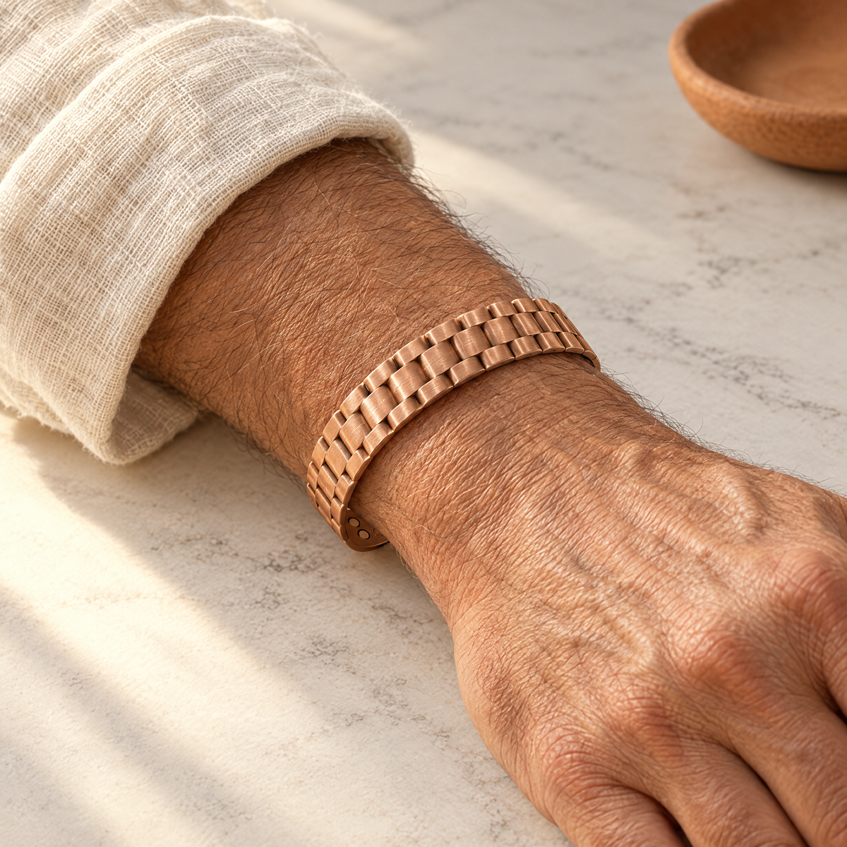 June's Ore Men's Copper Bracelet – pure copper bracelet on a warm neutral background - photo 2