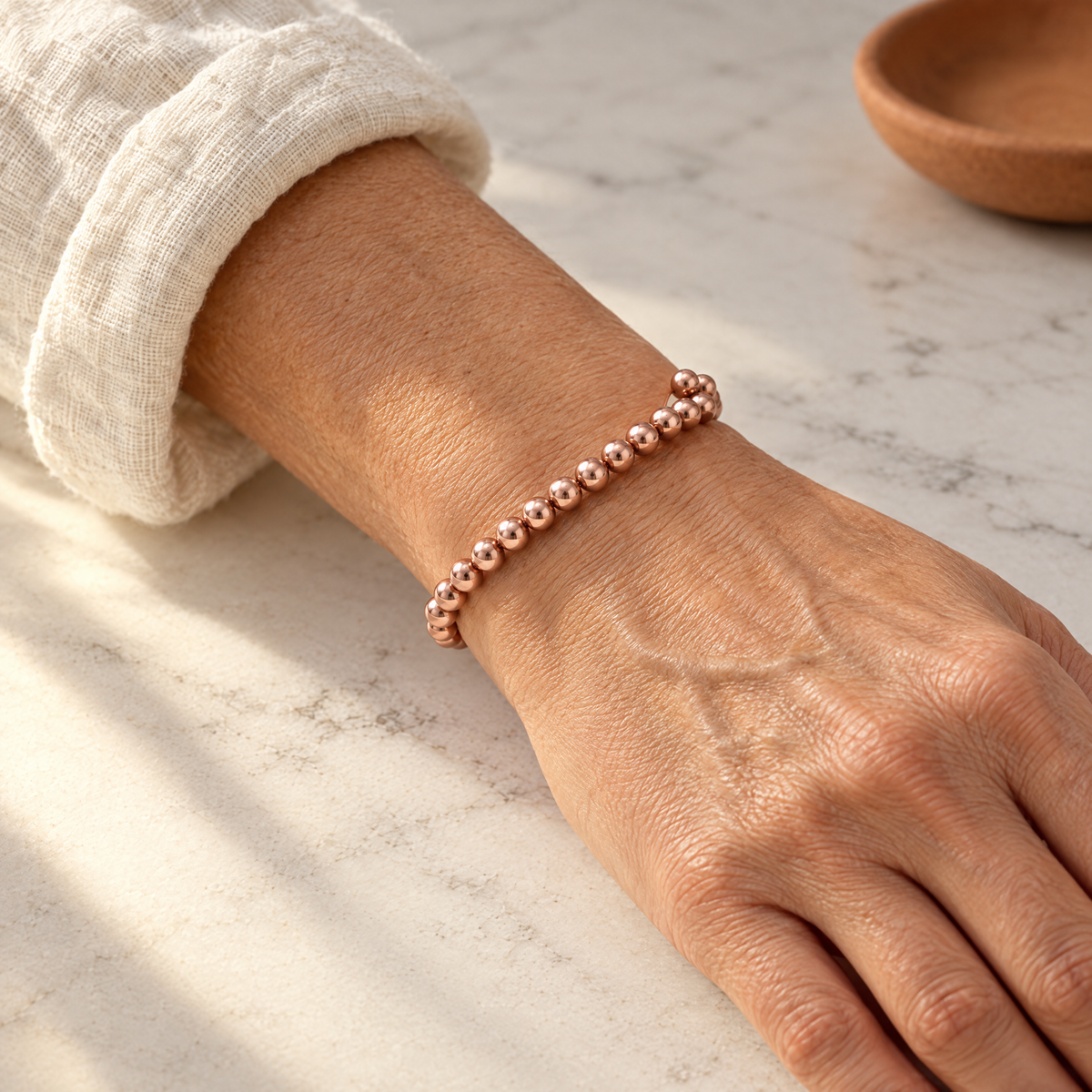 June's Prom Copper Bracelet – pure copper bracelet on a warm neutral background - photo 2